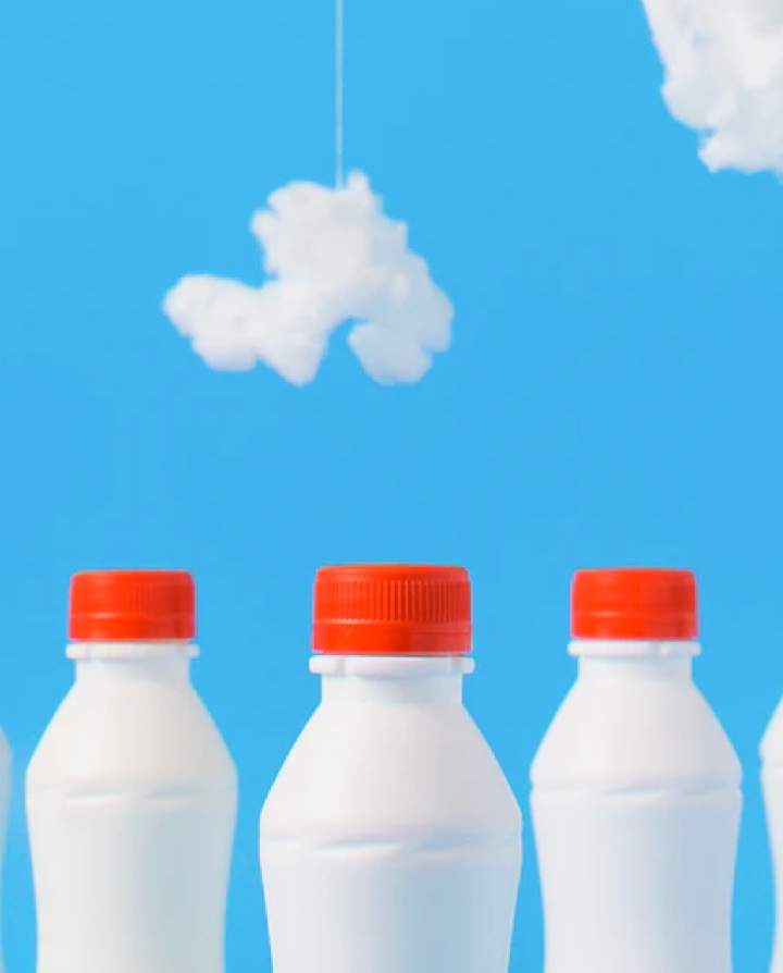 milk bottles with cloudy sky