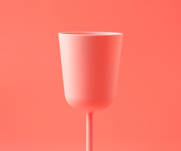 pink wine glass with pink background